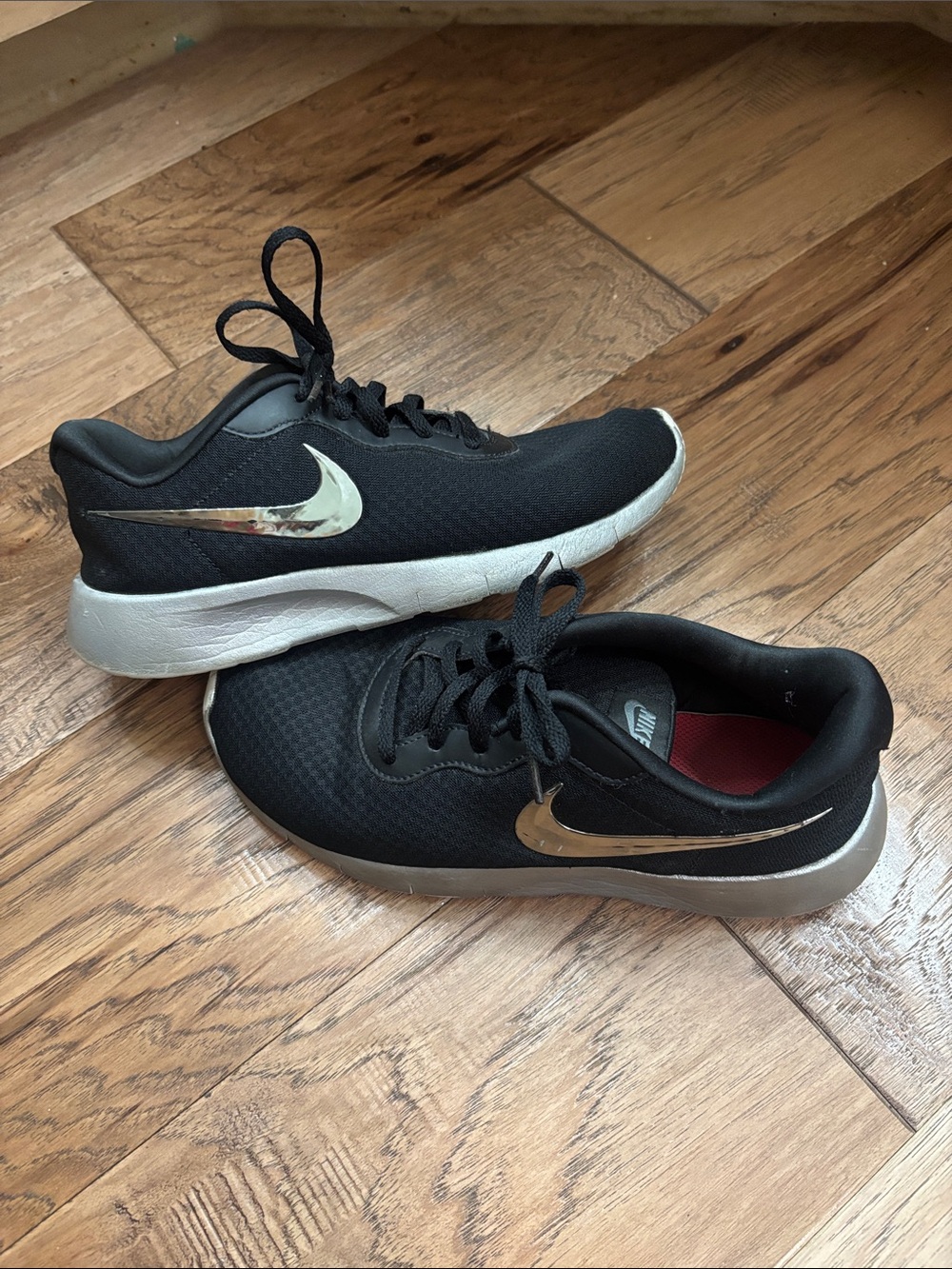 Nike Black Kids Sneakers with Metallic Silver Swoosh